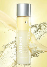 Skincare bottle labeled 'AGE-R' with a yellow liquid splash background