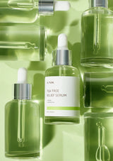 Tea tree relief serum bottles with visible brand label on a green background