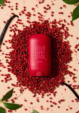 Red stick with 'Gellu' branding surrounded by red berries on a beige background