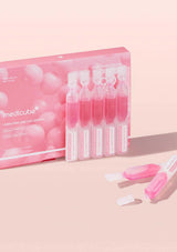 Medicube product packaging with bottles on a pink background