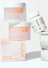 Heybell skincare products including jars and a box on a white background