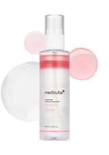 Medicube skincare serum bottle with pink bubbles on a white background