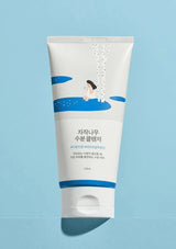 Tube of skincare product on a light blue background