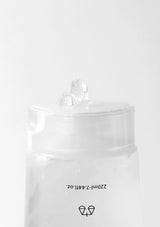 Clear plastic bag with a small object inside on a white background