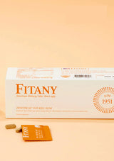 Fitany supplement packaging on a beige background