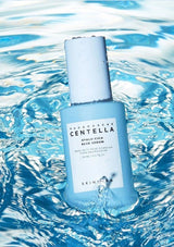 Blue skincare serum bottle with 'Mandarina Duck' branding on water