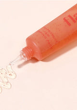 Pink lip balm with a visible brand name on a light pink background