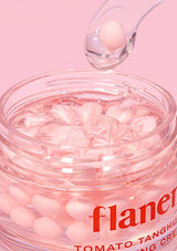 Jar of pink cream with 'flanel' branding on a pink background