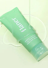 Green skincare mask tube with 'FANER' branding on a light green background