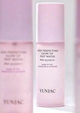 Pink skincare bottle labeled 'YUNJAC' on a white background