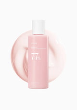 Pink bottle with white cap on a light pink background