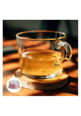 BODYLUV Vita Pure Filter in Green Tea scent, shown with the pink filter cartridge and a warm cup of tea.