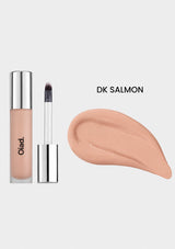 Makeup product with applicator and color swatch labeled 'DK Salmon' on a white background