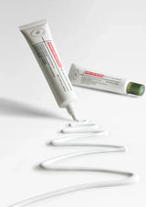 Two tubes of cream with a white background