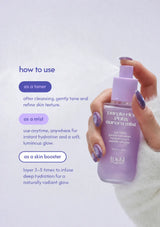 A hand with purple glitter nail polish holds a bottle of TDKJ Aurora Mist toner. The image features a light lavender background with text detailing how to use the mist as a toner, mist, or skin booster.