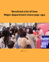 People at a major department store pop-up event with a yellow border and text.