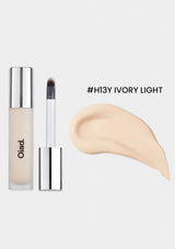 Cosmetic product with applicator and color swatch labeled '#H13Y IVORY LIGHT' on a white background