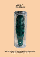 Green hair brush in a clear cylindrical container on a beige background