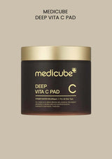 Medicube Deep Vita C Pad container on a beige background