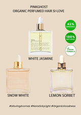 Three organic perfumed hair oils with labels for 'White Jasmine', 'Snow White', and 'Lemon Sorbet' on a beige background.