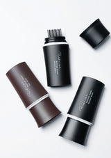 Set of black and brown hair removal devices on a white background