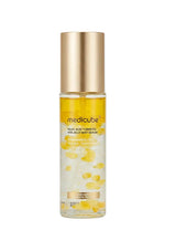 Medicube facial serum bottle with gold cap on a white background