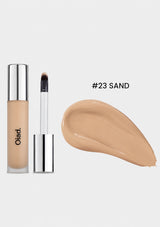 Cosmetic concealer stick with applicator and color swatch labeled '#23 Sand' on a white background.