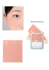 Makeup product with close-up of application on skin and color swatch.