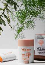 Medi-Balm skincare product with green leaves in the background