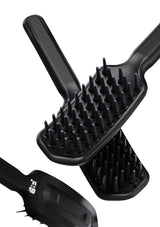 Black hairbrush with bristle design on a white background