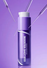 Purple bottle labeled 'Booster Shot' on a purple background