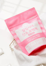 Pink packaging with white text on a white background