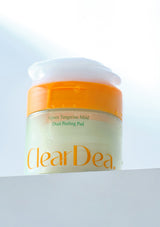 ClearDea skincare product jar with orange lid on a light background