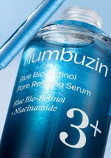Blue Bio-Retinol Pore Refining Serum bottle with 'humbuzin' branding on a light blue background