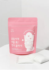 Pink packaging of a toilet cleaning product with Korean text on a white background