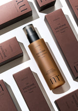 Exosome skincare product with brown bottle and packaging on a white background