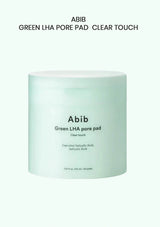 A pale mint green jar of Abib Green LHA Pore Pad in the Clear Touch variant, centered on a very light mint green background with black text above.