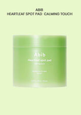 A light green jar of Abib Heartleaf Spot Pad Calming Touch on a pale green background with black text at the top reading 'ABIB HEARTLEAF SPOT PAD CALMING TOUCH'.