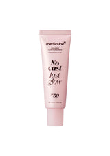 A pink squeeze tube of medicube No Cast Just Glow SPF 30 sunscreen, centered on a plain white background.