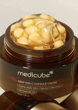 Jar of Medicube Deep Vita C Capsule Cream with visible capsules on a light background