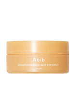 A peach-colored cosmetic jar labeled 'Abib Glutathione kojic acid eye patch' on a plain white background.