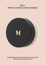 A compact container of MCC Perfect Finish Loose Powder with its lid open, showing the powder inside. The compact is labeled with the product name and features.