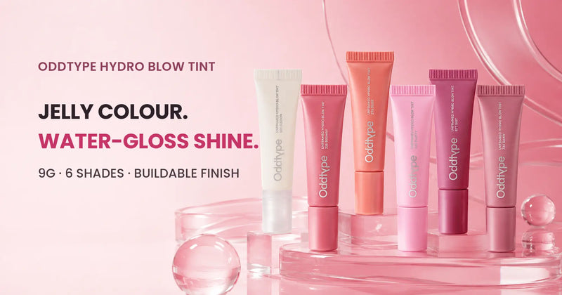 Six ODDTYPE Hydro Blow Tint tubes staged on glossy pink acrylic plinths