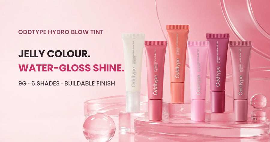 Six ODDTYPE Hydro Blow Tint tubes staged on glossy pink acrylic plinths