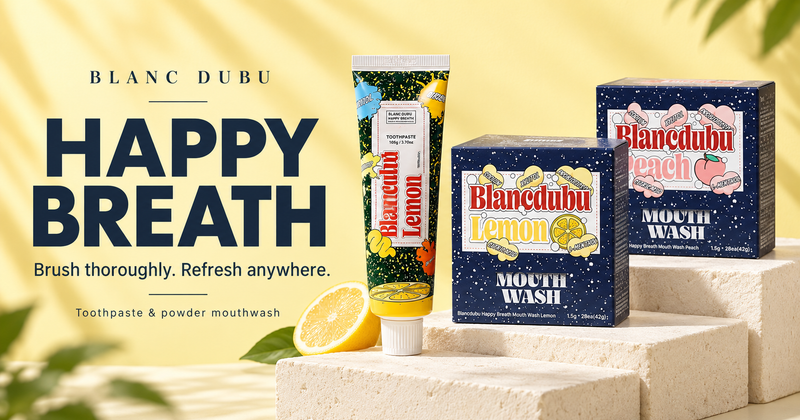 Blanc Dubu Happy Breath lemon toothpaste and lemon and peach powder mouthwash on a warm yellow background