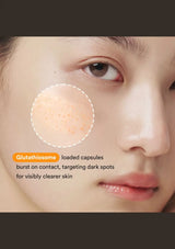 ABIB Vita Drop serum capsules shown on skin for targeted dark spot care