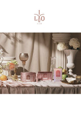 Decorative table setting with 'LYO' products and decor items.