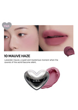 Lipstick with a heart-shaped cap on a white background, featuring the brand name.