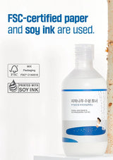 Bottle with FSC-certified paper and soy ink usage text and symbols on a white background.