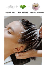 Person washing hair with text indicating organic salt, mint menthol, and sea salt shampoo.
